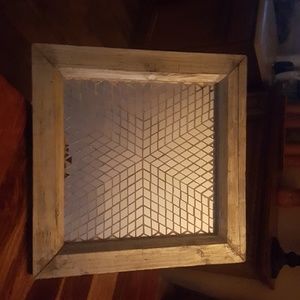 A wood frame mirror wall hanging